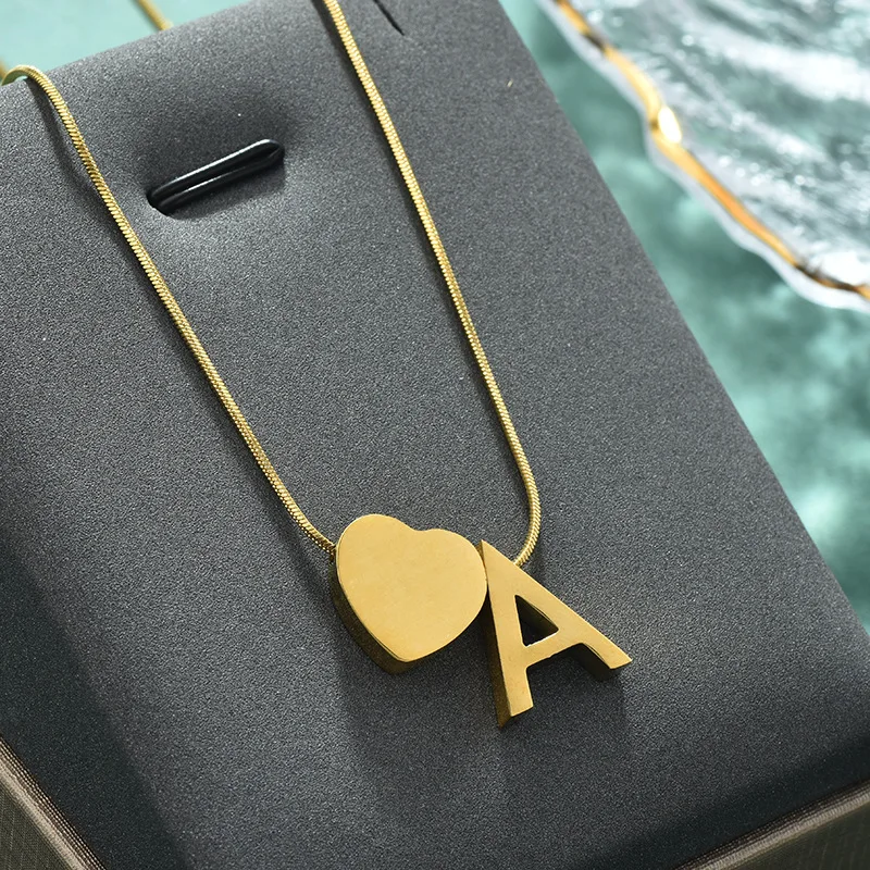 The simple and fashionable peach-shaped letter heart titanium steel necklace and snake chain are popular necklaces nowadays 
The simple and fashionable peach-shaped letter heart titanium steel necklace and snake chain are popular necklaces nowadays