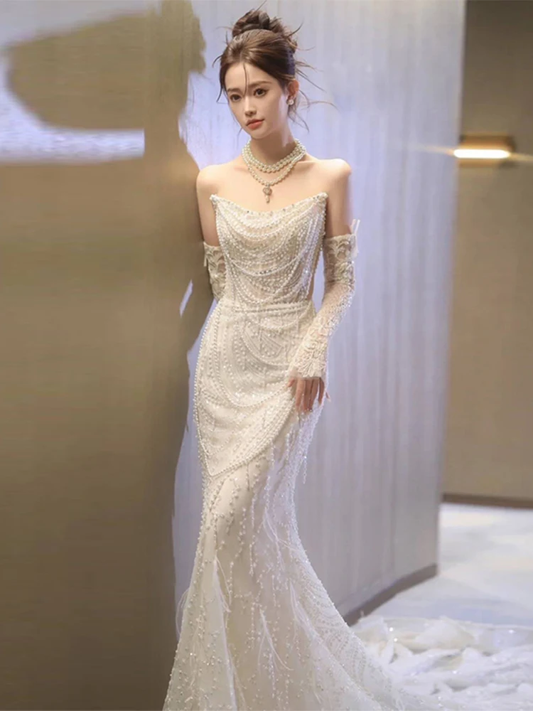 Элегантное свадебное платье с жемчужной отделкой и шлейфом, белое, для женщин, с богатой вышивкой, свадебное платье для коктейльной вечеринки
Элегантное свадебное платье с жемчужной отделкой и шлейфом, белое, для женщин, с богатой вышивкой, свадебное платье для коктейльной вечеринки