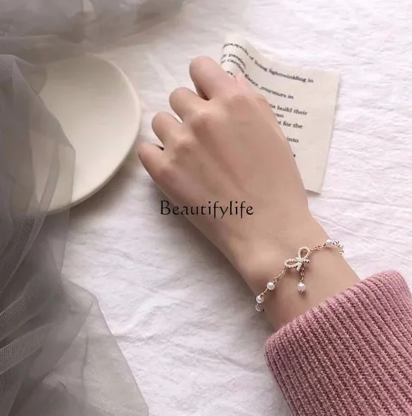 Spring Bow Pearl Bracelet Women's Korean Version Sweet Versatile Summer Accessories
Spring Bow Pearl Bracelet Women's Korean Version Sweet Versatile Summer Accessories