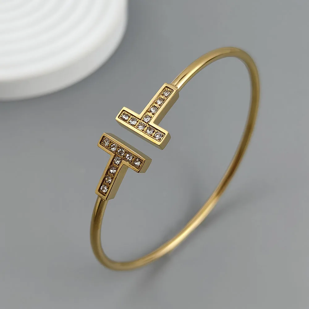 Cheap T-shaped gold-plated stainless steel slim waist zircon bangle, Halloween, Thanksgiving, Christmas, and New Year gifts
Cheap T-shaped gold-plated stainless steel slim waist zircon bangle, Halloween, Thanksgiving, Christmas, and New Year gifts