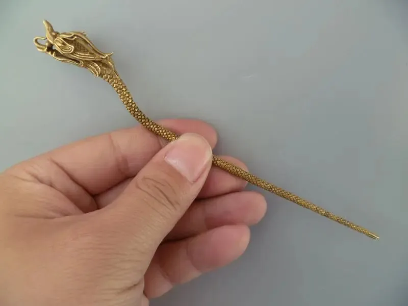 Antique collection dragon head hair ornament pure brass hairpin Statue
Antique collection dragon head hair ornament pure brass hairpin Statue