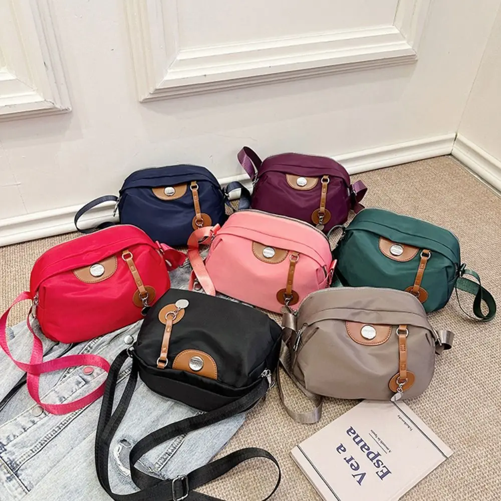 Portable Shell Nylon Crossbody Bag Waterproof Large Capacity Messenger Shoulder Bag Solid Color Casual Oxford Cloth Dumpling Bag
Portable Shell Nylon Crossbody Bag Waterproof Large Capacity Messenger Shoulder Bag Solid Color Casual Oxford Cloth Dumpling Bag