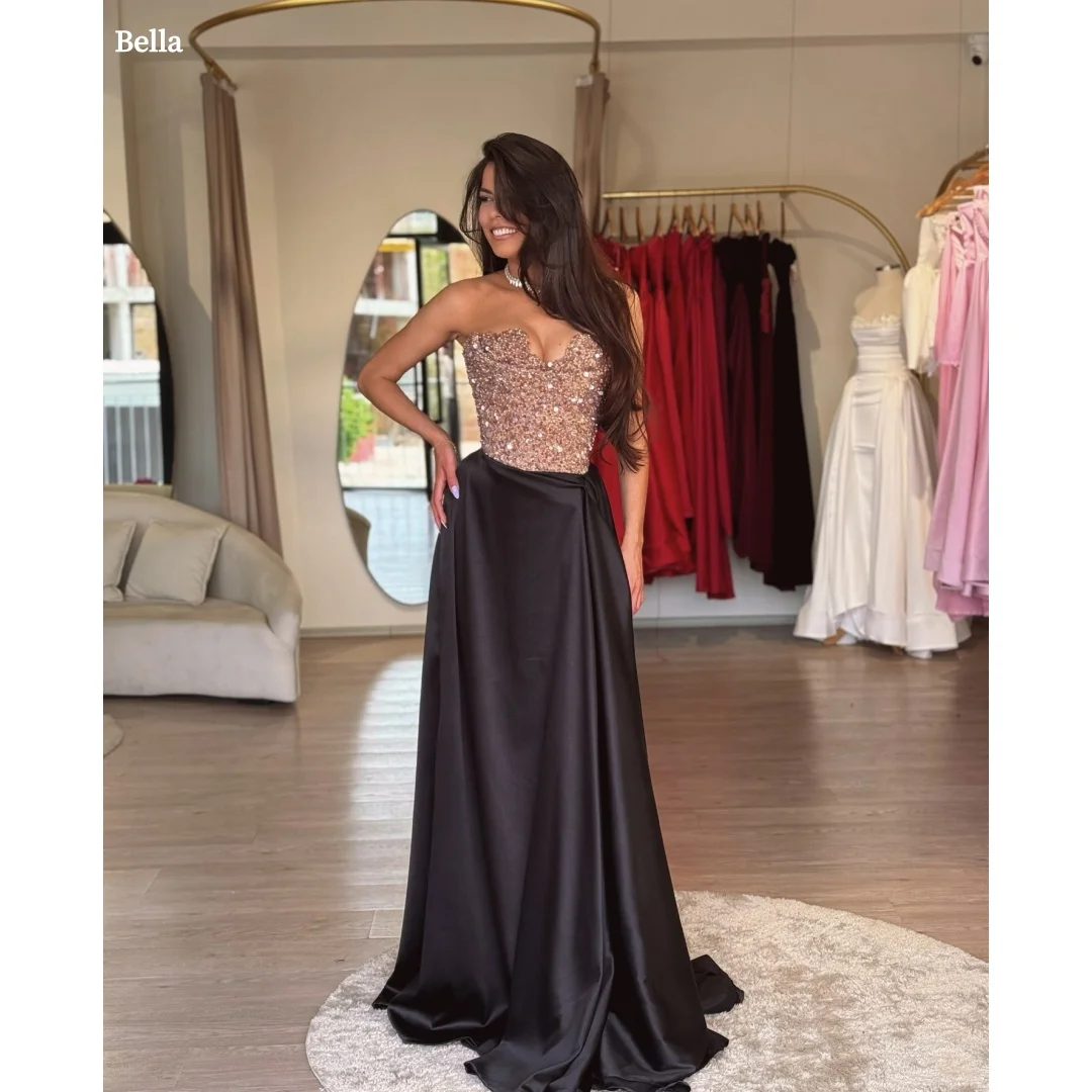 Bella Customized Champagne Sequin Sweetheart Strapless Prom Dress Black Satin Maxi Party Dresses Elegant Formal robes de soirée
Bella Customized Champagne Sequin Sweetheart Strapless Prom Dress Black Satin Maxi Party Dresses Elegant Formal robes de soirée