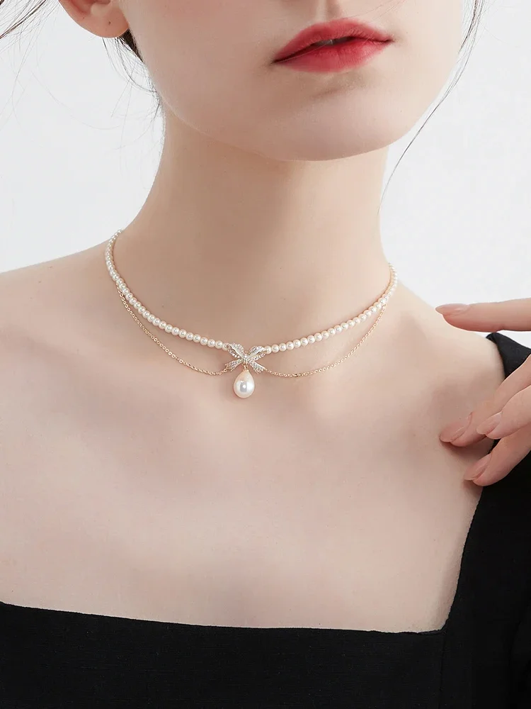 Double bow imitation pearl necklace women's niche temperament neck chain accessories
Double bow imitation pearl necklace women's niche temperament neck chain accessories