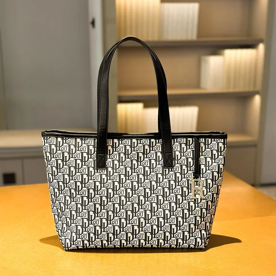 Handbag Large Capacity Shoulder Bag for The Modern Woman - High - End, Fashion - Niche, and Leisure - Inspired Lady's Tote Bag
Handbag Large Capacity Shoulder Bag for The Modern Woman - High - End, Fashion - Niche, and Leisure - Inspired Lady's Tote Bag