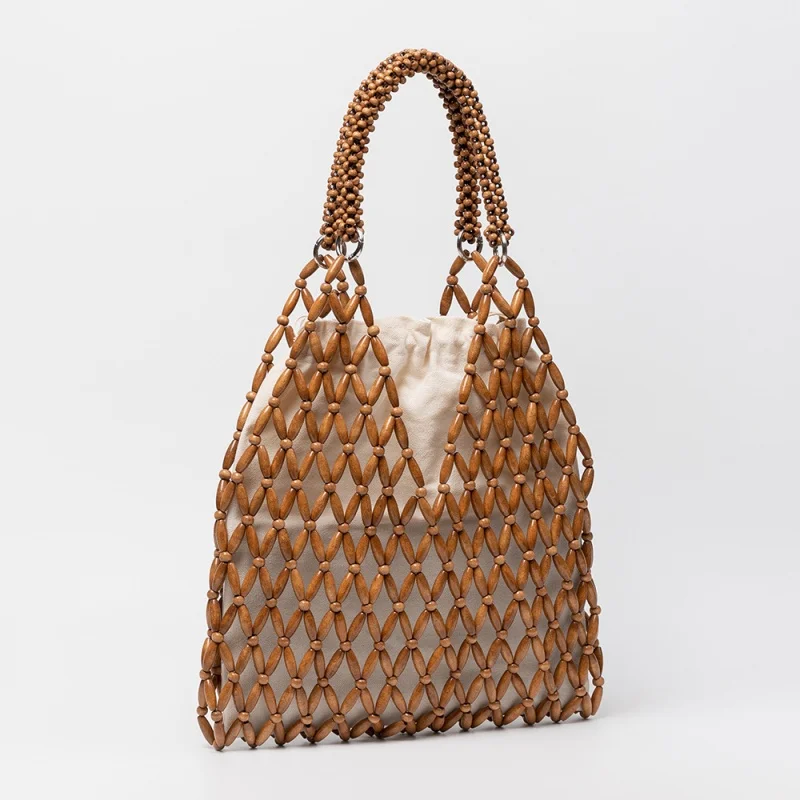 Boho Style Hollow Out Shoulder Bag 2026 New Seaside Natural Maple Wooden Beads Woven Bag Beach Holiday Tote Bag Сумка Женская
Boho Style Hollow Out Shoulder Bag 2026 New Seaside Natural Maple Wooden Beads Woven Bag Beach Holiday Tote Bag Сумка Женская