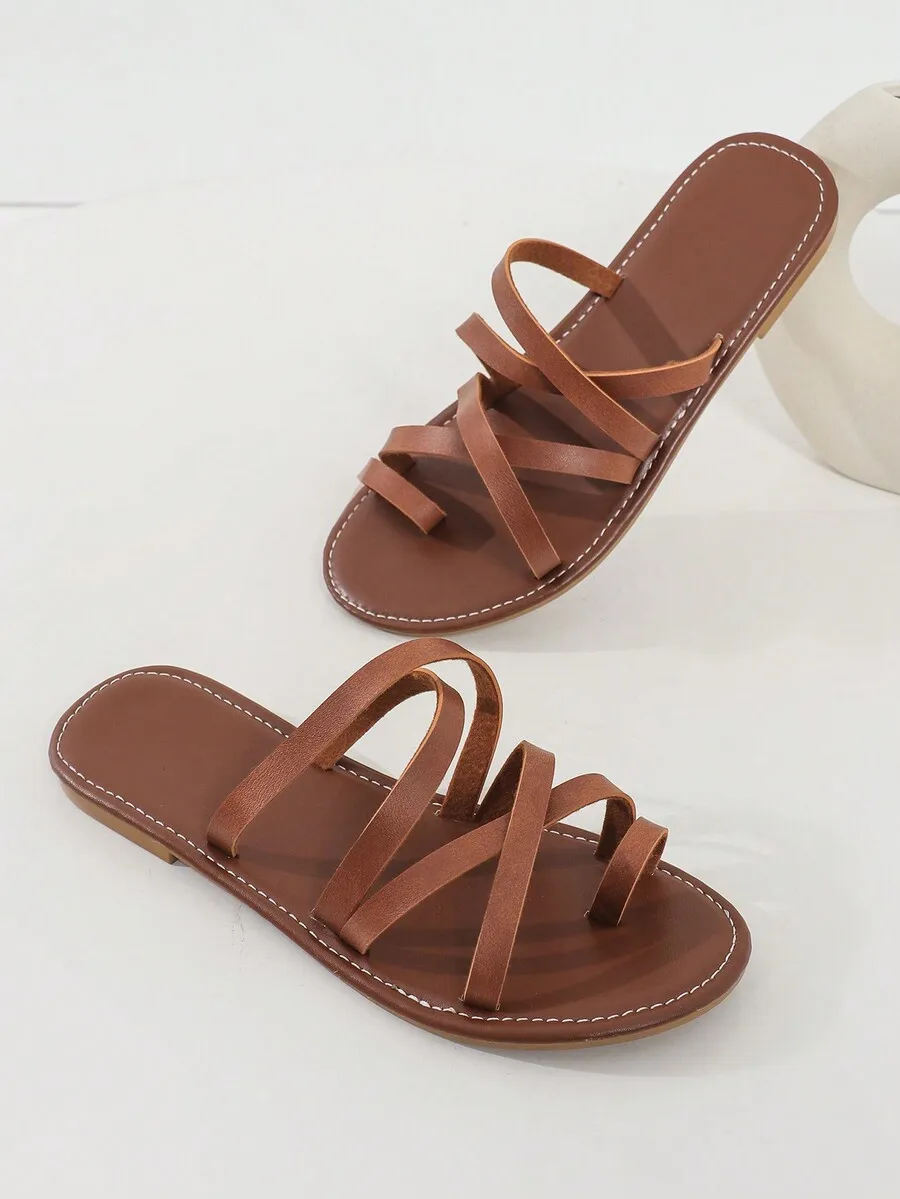 Women’s Brown Flat Slide Sandals Featuring Overlapping Straps And Toe Loop For Casual Summer Beach Use
Women’s Brown Flat Slide Sandals Featuring Overlapping Straps And Toe Loop For Casual Summer Beach Use