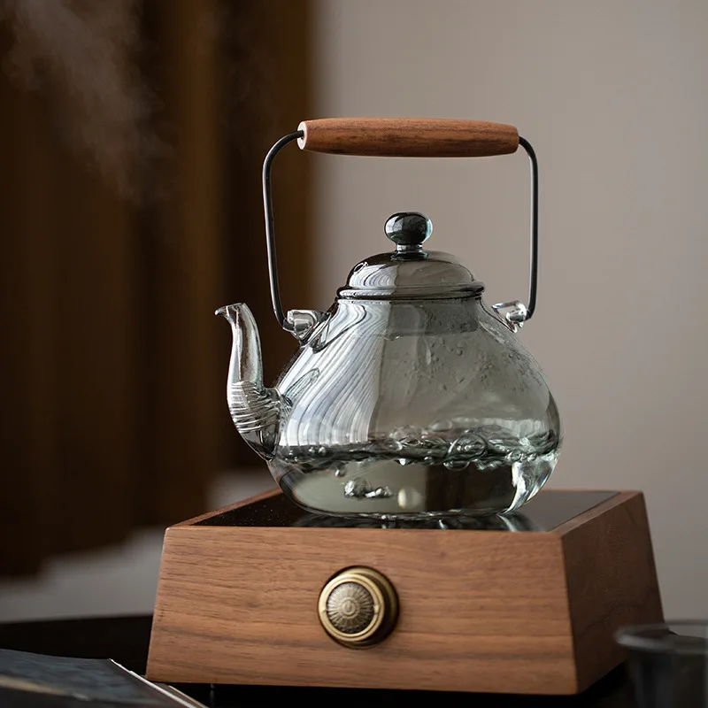 Japanese Style Large Capacity Glass Tea Pot with Wooden Handle Heat Resistant Stove Top Tea Kettle Retro Style Ash Tray Included
Japanese Style Large Capacity Glass Tea Pot with Wooden Handle Heat Resistant Stove Top Tea Kettle Retro Style Ash Tray Included