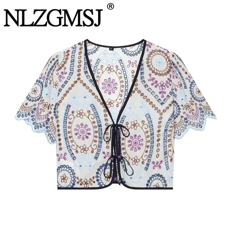 Nlzgmsj 2026 Summer Women Embroidered Blouse V Neck Tie Front Short Sleeve Hollow Out Embroidery Shirt Boho Casual Chic Tops
Nlzgmsj 2026 Summer Women Embroidered Blouse V Neck Tie Front Short Sleeve Hollow Out Embroidery Shirt Boho Casual Chic Tops