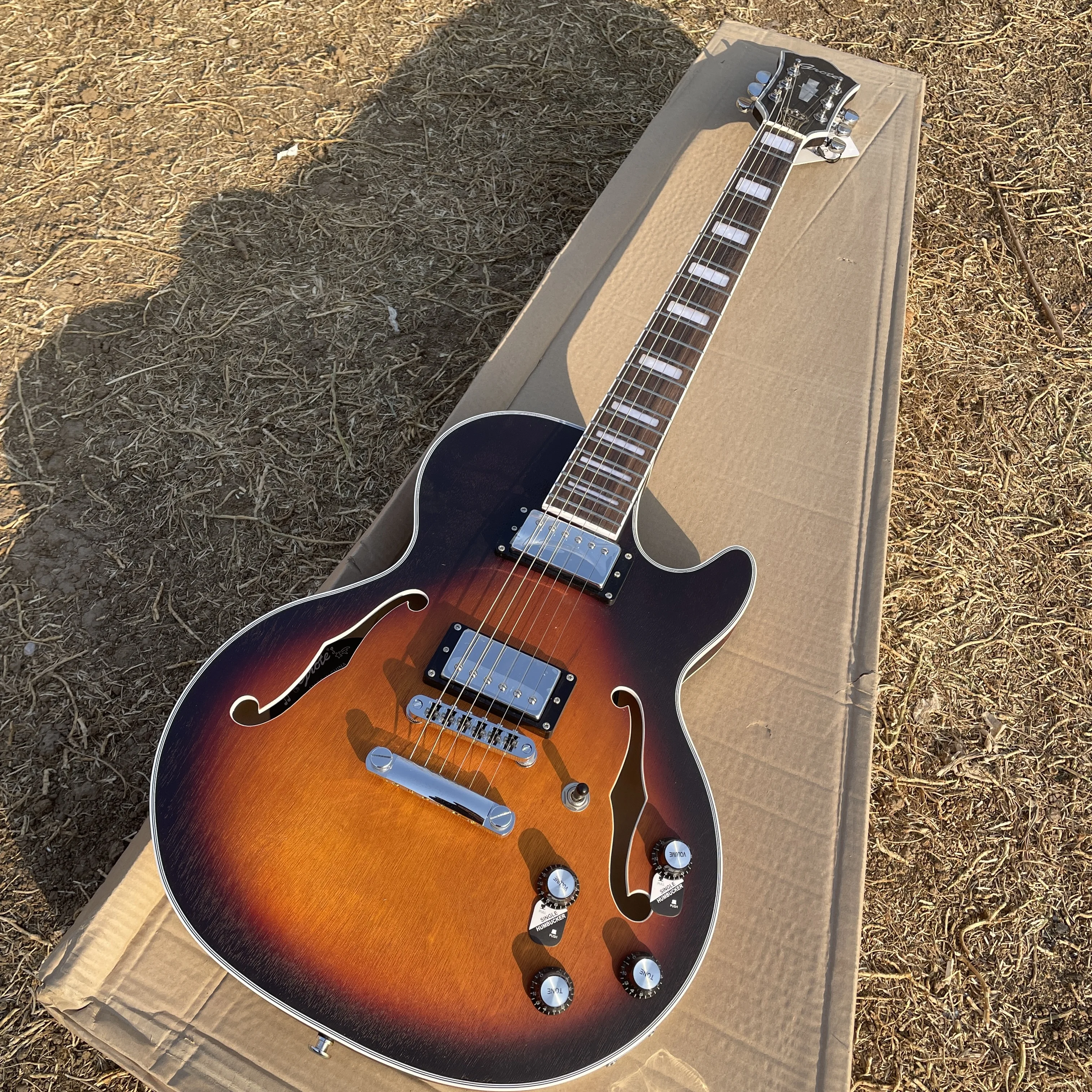Black brown F hole electric guitar, 6-string electric guitar, classic jazz electric guitar
Black brown F hole electric guitar, 6-string electric guitar, classic jazz electric guitar