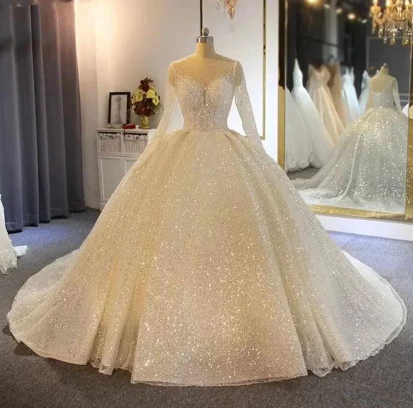 Customized 2026 new model Luxurious Sparkling Ball Gown Wedding Dresses Sheer Appliqued Sequins Long Sleeves Lace Bridal Gowns
Customized 2026 new model Luxurious Sparkling Ball Gown Wedding Dresses Sheer Appliqued Sequins Long Sleeves Lace Bridal Gowns