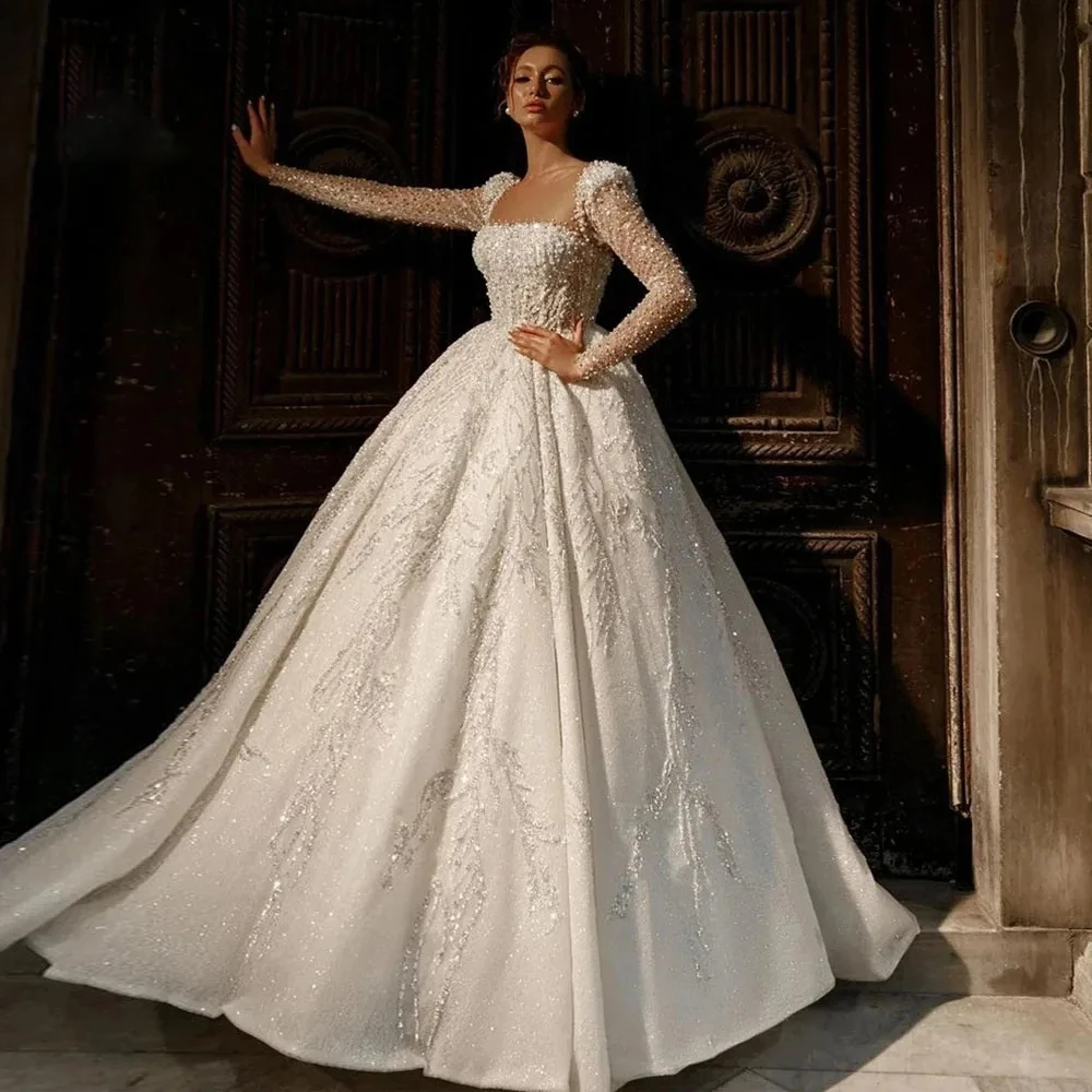 2025 Luxury Wedding Dress Boat Neck Lace Embroidery Long Sleeve Ball Gown Bride Gowns Vestidos De Noiva Customized
2025 Luxury Wedding Dress Boat Neck Lace Embroidery Long Sleeve Ball Gown Bride Gowns Vestidos De Noiva Customized