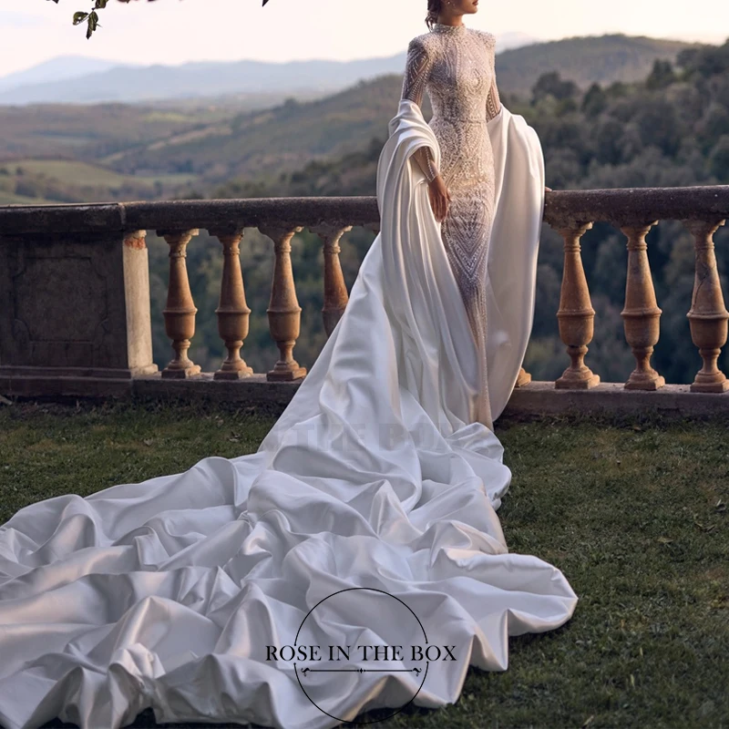 ROSEINTHEBOX Customized Elegant High Quality Lace Wedding Dress Beaded High Neck Long Fitted Sleeves Mermaid with Subtle Train
ROSEINTHEBOX Customized Elegant High Quality Lace Wedding Dress Beaded High Neck Long Fitted Sleeves Mermaid with Subtle Train