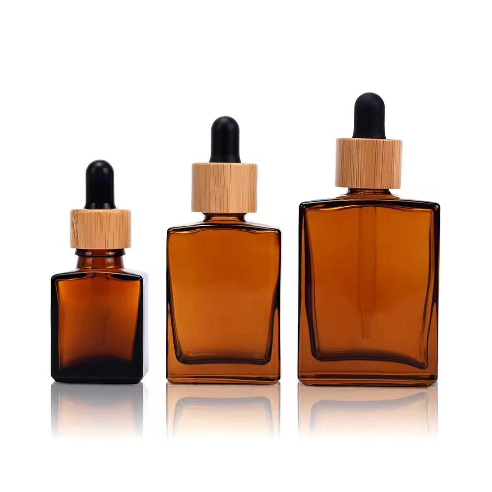 Amber Square Glass Serum Bottle with Press Pump Spray Vials Travel Essential Oil Dropper Bottle With Natural Bamboo Wooden Lids
Amber Square Glass Serum Bottle with Press Pump Spray Vials Travel Essential Oil Dropper Bottle With Natural Bamboo Wooden Lids