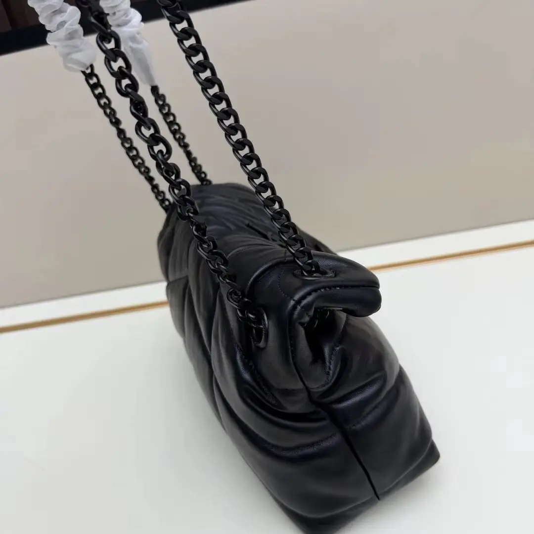 Chevron Stitch Puffy Crossbody Purse, Fold Over Pointed Front Flap, Smooth Lambskin Texture, All-Black Dark Tone Hardware.
Chevron Stitch Puffy Crossbody Purse, Fold Over Pointed Front Flap, Smooth Lambskin Texture, All-Black Dark Tone Hardware.