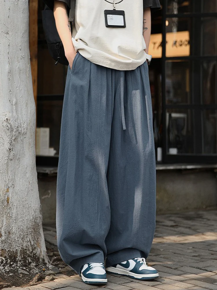 Свободные широкие повседневные брюки, мужские весенне-летние драпированные прямые брюки-трубы, удобная дышащая мужская одежда в японском стиле
Свободные широкие повседневные брюки, мужские весенне-летние драпированные прямые брюки-трубы, удобная дышащая мужская одежда в японском стиле