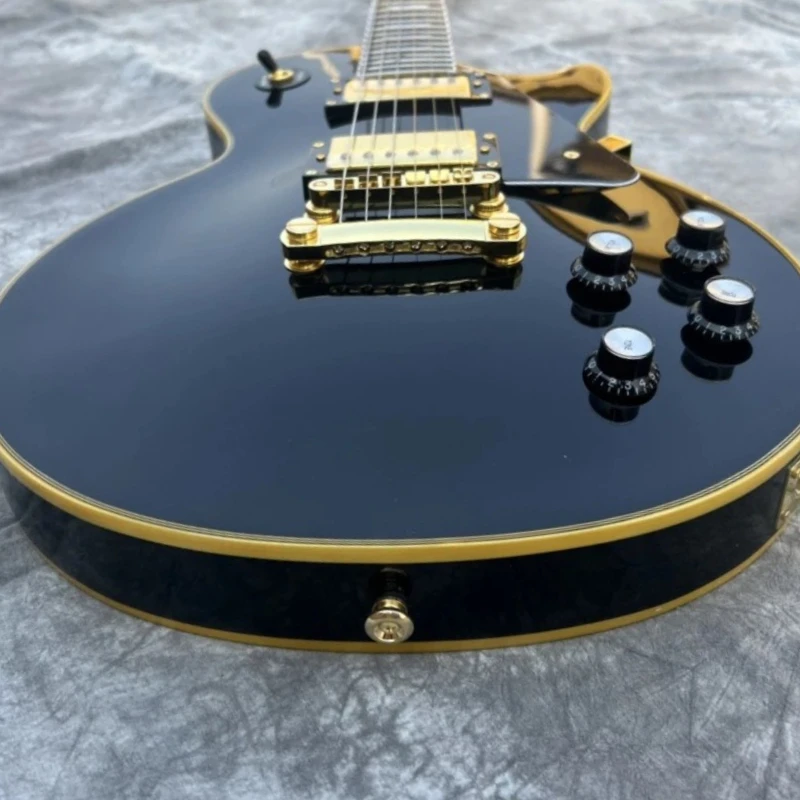 Free Shipping Black L Mahogany Body Ebony Fingerboard Electric Guitar Fixed Bridge Rock Music Black Gold Finish Gold Binding
Free Shipping Black L Mahogany Body Ebony Fingerboard Electric Guitar Fixed Bridge Rock Music Black Gold Finish Gold Binding