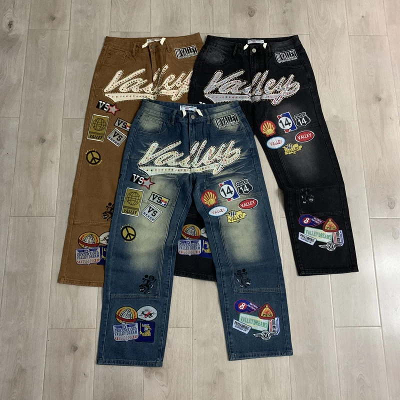VALLEY Embroidery Colorful Rhinestone Badge Loose Straight Jeans Pants Men Women High Quality Brown Black Blue Denim Trousers
VALLEY Embroidery Colorful Rhinestone Badge Loose Straight Jeans Pants Men Women High Quality Brown Black Blue Denim Trousers