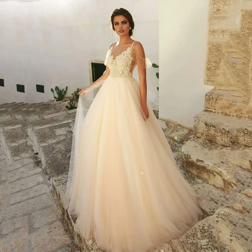 Customized 2025 Lace Appliques Bridal Dress Spaghetti Straps Tulle Sleeveless Brides Gown Illusion Princess Boho Wedding Dress
Customized 2025 Lace Appliques Bridal Dress Spaghetti Straps Tulle Sleeveless Brides Gown Illusion Princess Boho Wedding Dress