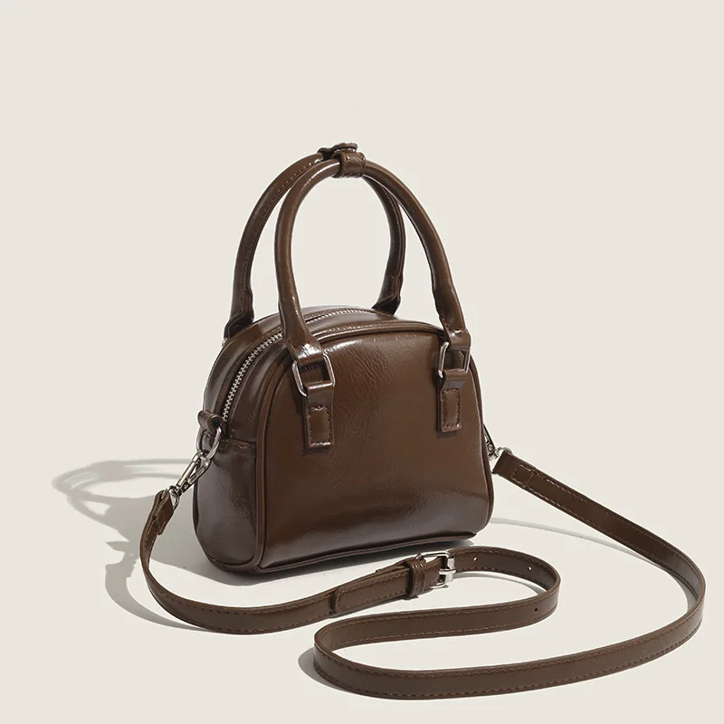 Korean niche design handbag 2025 new commuter handbag retro fashion crossbody shell bag for women
Korean niche design handbag 2025 new commuter handbag retro fashion crossbody shell bag for women