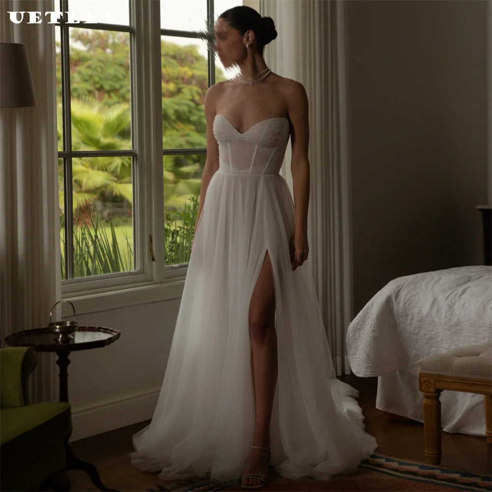 UETEEY Customized V Neck Shiny Strapless Pleats Wedding Dress Tulle High Side Slit Floor Length Court Train Bridal Gown
UETEEY Customized V Neck Shiny Strapless Pleats Wedding Dress Tulle High Side Slit Floor Length Court Train Bridal Gown