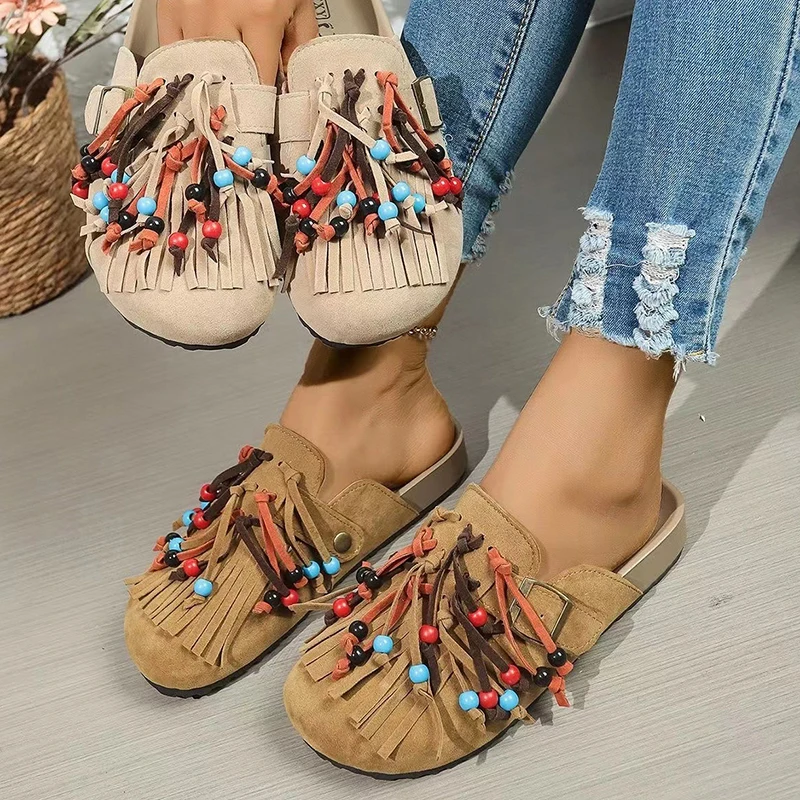 Retro Suede Slippers Women Tassel Stringe Bead Decoration Flat luxurious Shoes Outdoor Vacation Lazy Mules leisure beach sandals
Retro Suede Slippers Women Tassel Stringe Bead Decoration Flat luxurious Shoes Outdoor Vacation Lazy Mules leisure beach sandals