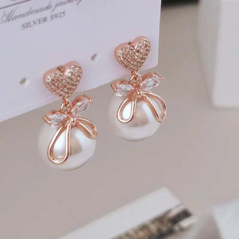 Серьги-гвоздики из серебра S925 пробы с жемчугом, элегантные темпераментные серебряные серьги с любовным инкрустированным цирконием бантом
Серьги-гвоздики из серебра S925 пробы с жемчугом, элегантные темпераментные серебряные серьги с любовным инкрустированным цирконием бантом