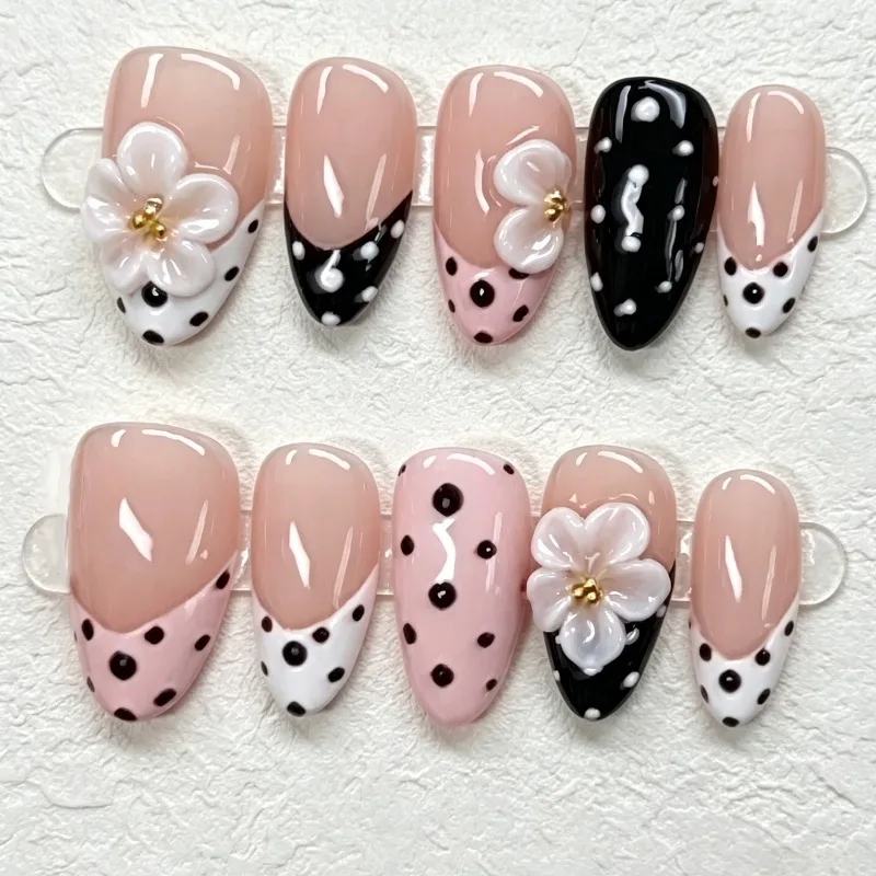24PCS Nude Pink Almond False Nails Simple Black Polka Dots French with Sweet 3D White Flowers Press on Nails Full Cover Wearable
24PCS Nude Pink Almond False Nails Simple Black Polka Dots French with Sweet 3D White Flowers Press on Nails Full Cover Wearable