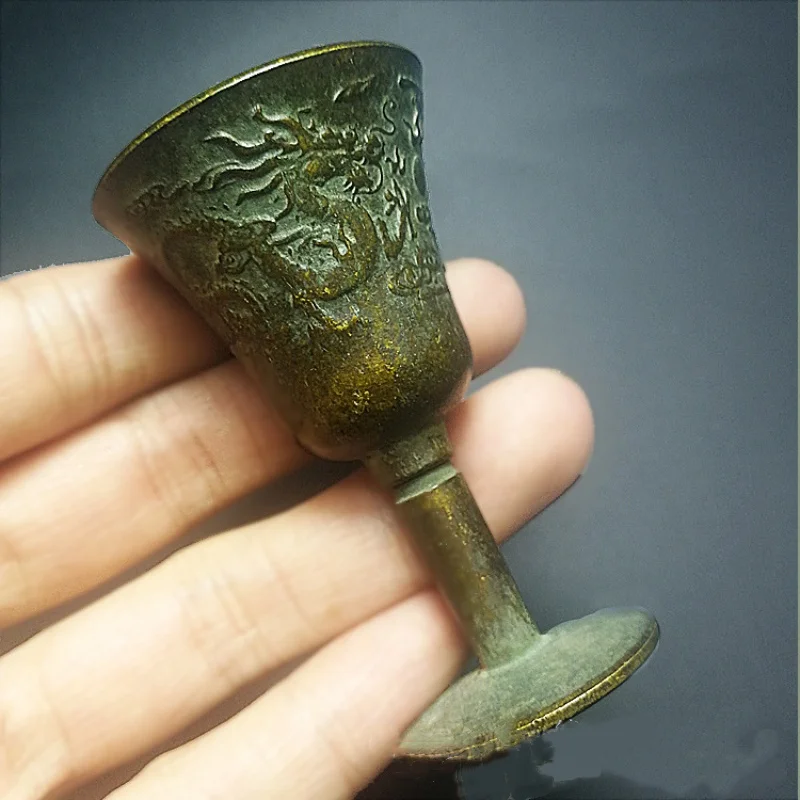 Chinese antique bronze dragon and phoenix patterned high footed wine glass ornament for collecting copper handicrafts
Chinese antique bronze dragon and phoenix patterned high footed wine glass ornament for collecting copper handicrafts