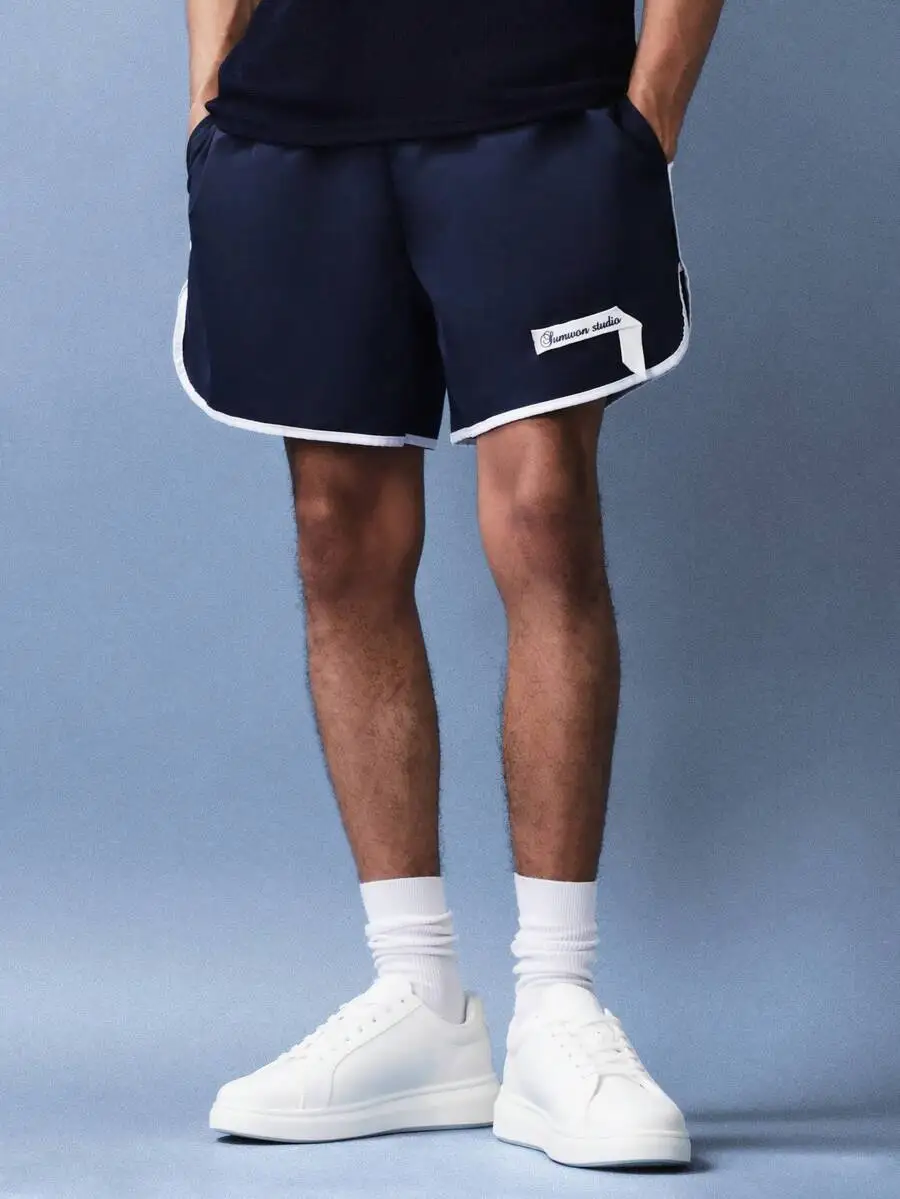 Blue Swim Shorts With White Trim, Side Pockets, And Contrast Stitching For Beach Summer Wear
Blue Swim Shorts With White Trim, Side Pockets, And Contrast Stitching For Beach Summer Wear