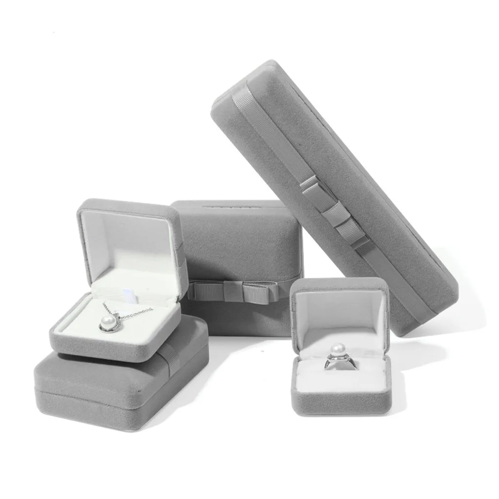 Velvet Luxury Jewelry Packaging Box Bow Design Jewelry Storage Grey Box for Rings Pendants Bracelets Bangles Display Gift Box
Velvet Luxury Jewelry Packaging Box Bow Design Jewelry Storage Grey Box for Rings Pendants Bracelets Bangles Display Gift Box