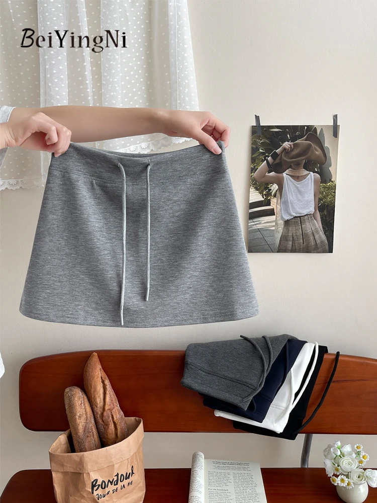 Beiyingni Summer Korean Chic Mini Skirts for Women Pure Color 2026 Fashion Female Shorts Pencil Skirt Casual Sports Grey Skirt
Beiyingni Summer Korean Chic Mini Skirts for Women Pure Color 2026 Fashion Female Shorts Pencil Skirt Casual Sports Grey Skirt