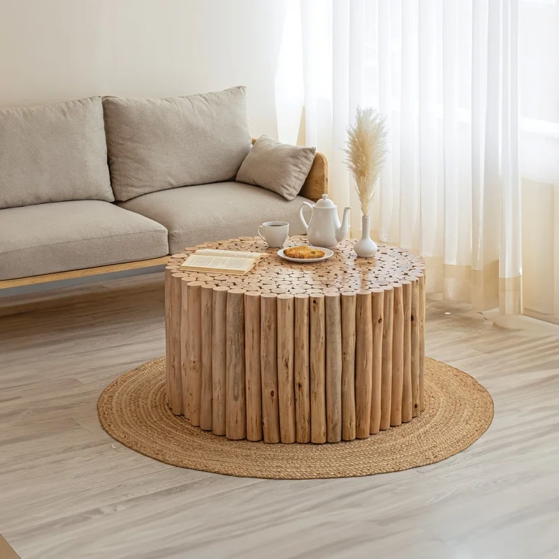 Handcrafted Round Coffee Table from Natural Wooden Logs with Detailed Carved Top, Earthy Rustic Style
Handcrafted Round Coffee Table from Natural Wooden Logs with Detailed Carved Top, Earthy Rustic Style