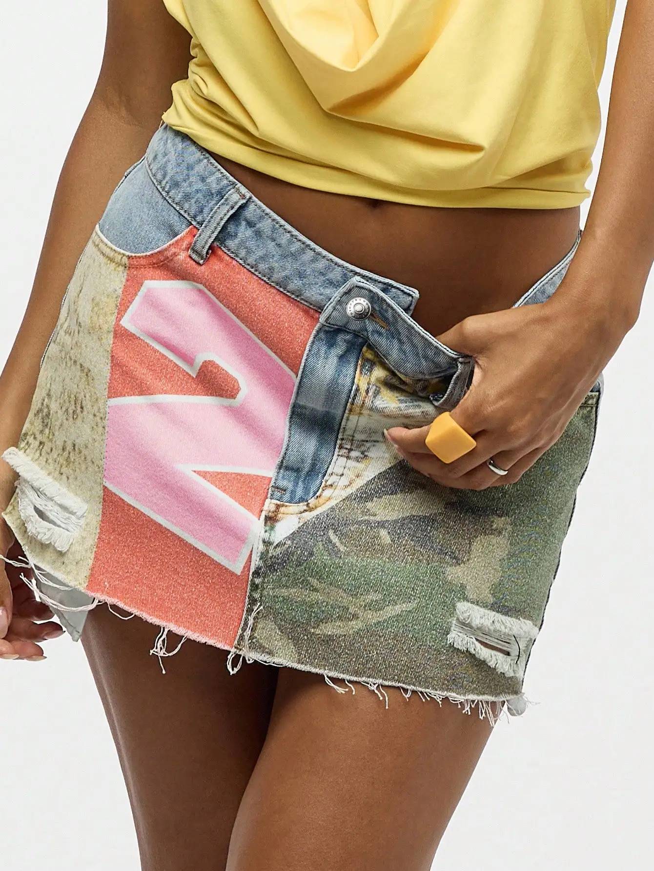 Women's Distressed Patchwork Denim Mini Skirt with Graphic Print and Raw Hem
Women's Distressed Patchwork Denim Mini Skirt with Graphic Print and Raw Hem