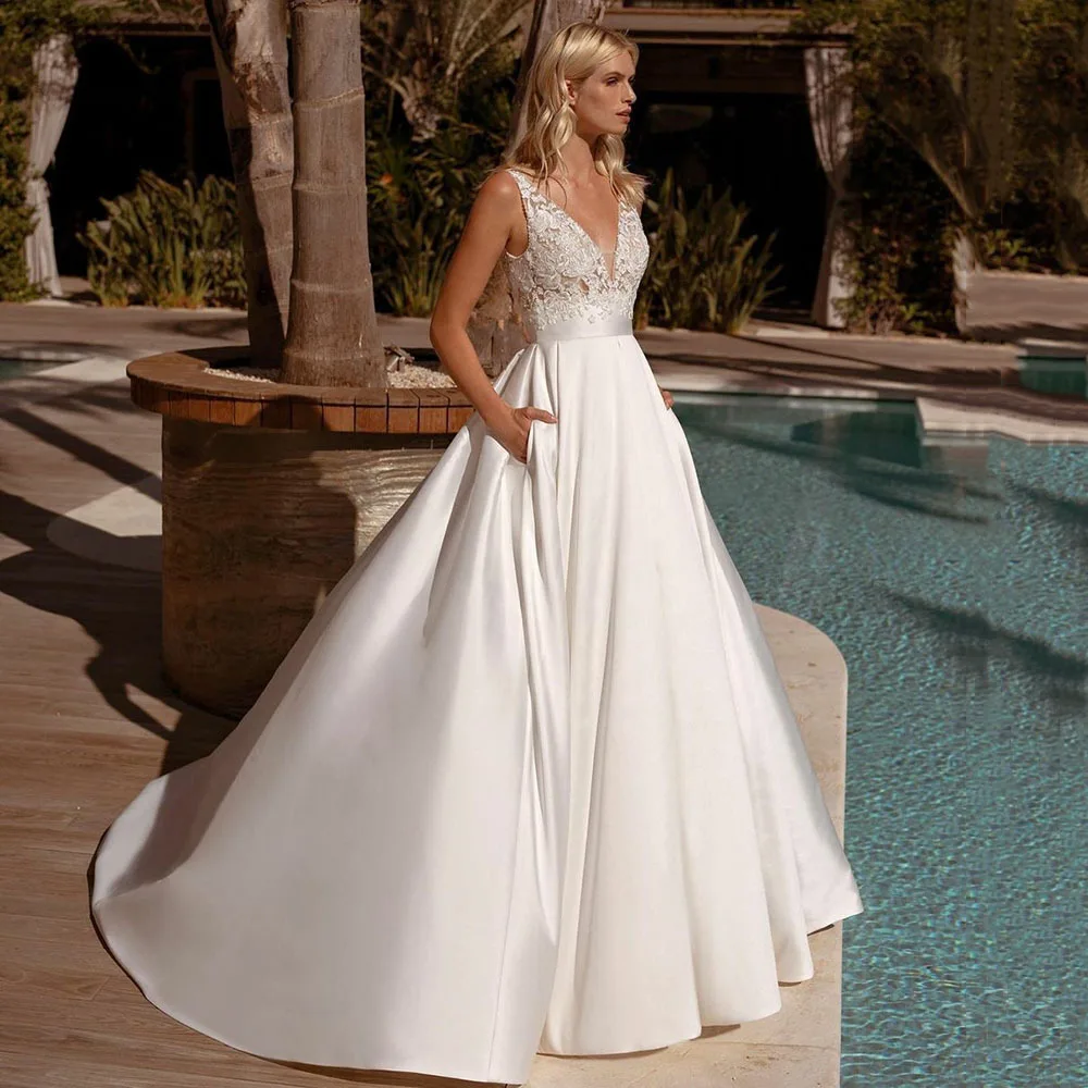 Boho Vestido De Noiva Элегантное свадебное платье трапециевидной формы с v-образным вырезом и атласной кружевной аппликацией размера плюс Свадебные платья
Boho Vestido De Noiva Элегантное свадебное платье трапециевидной формы с v-образным вырезом и атласной кружевной аппликацией размера плюс Свадебные платья