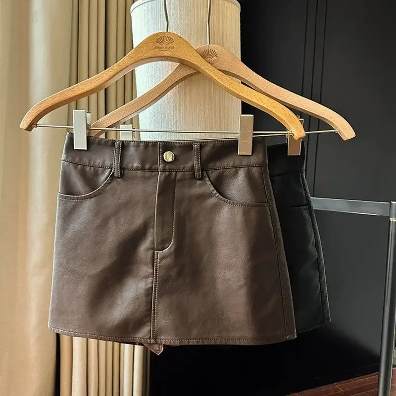 Юбки женские уютные из искусственной кожи Faldas элегантные корейские модные нежные винтажные трапециевидные универсальные уличные стильные женские ампирные однотонные повседневные офисные юбки
Юбки женские уютные из искусственной кожи Faldas элегантные корейские модные нежные винтажные трапециевидные универсальные уличные стильные женские ампирные однотонные повседневные офисные юбки