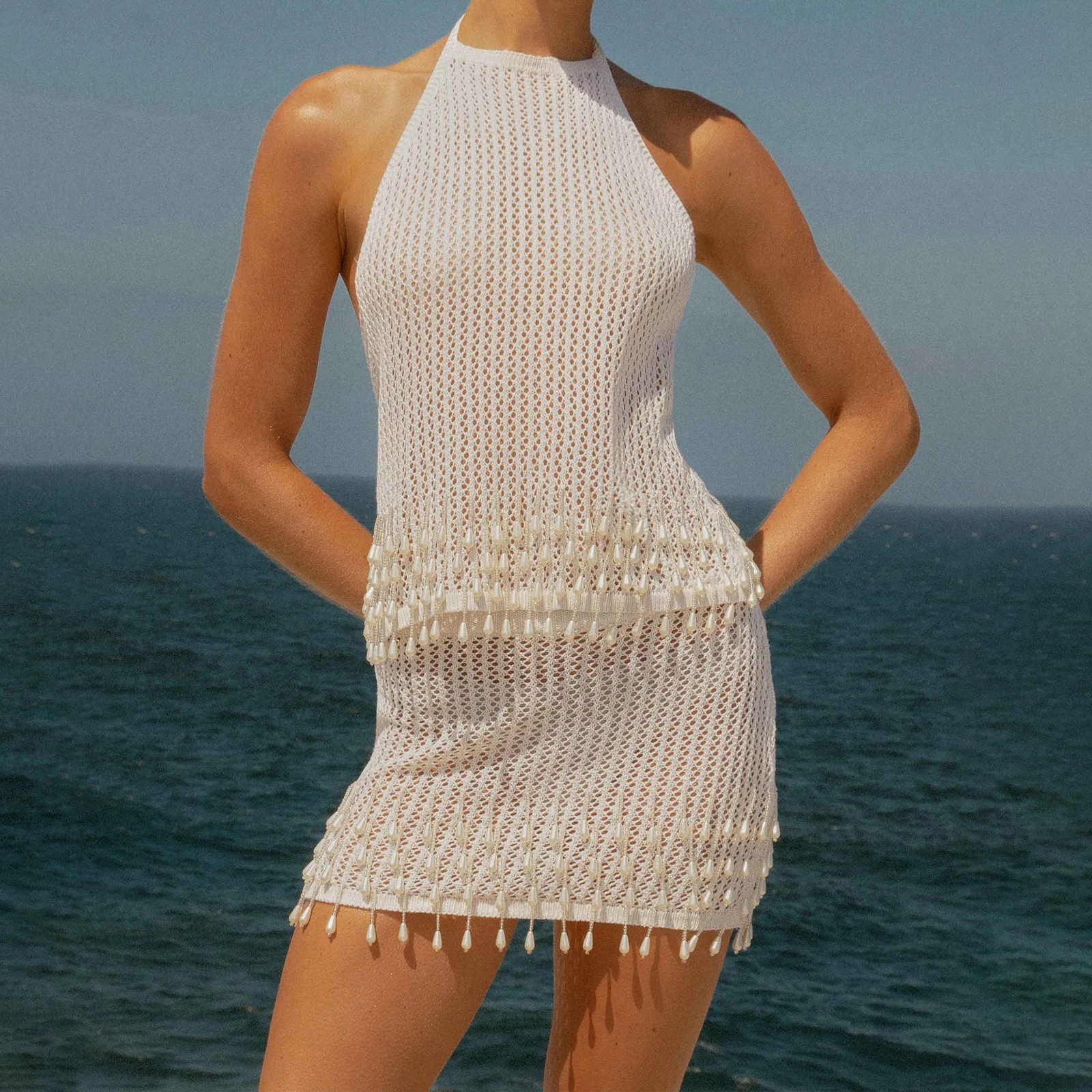 2025 Sexy Women's Knit Skirt Set for Summer Stylish Solid Hollow Out Tie Back Backless Halter Tops with Mini Skirt 2 Pcs Set
2025 Sexy Women's Knit Skirt Set for Summer Stylish Solid Hollow Out Tie Back Backless Halter Tops with Mini Skirt 2 Pcs Set