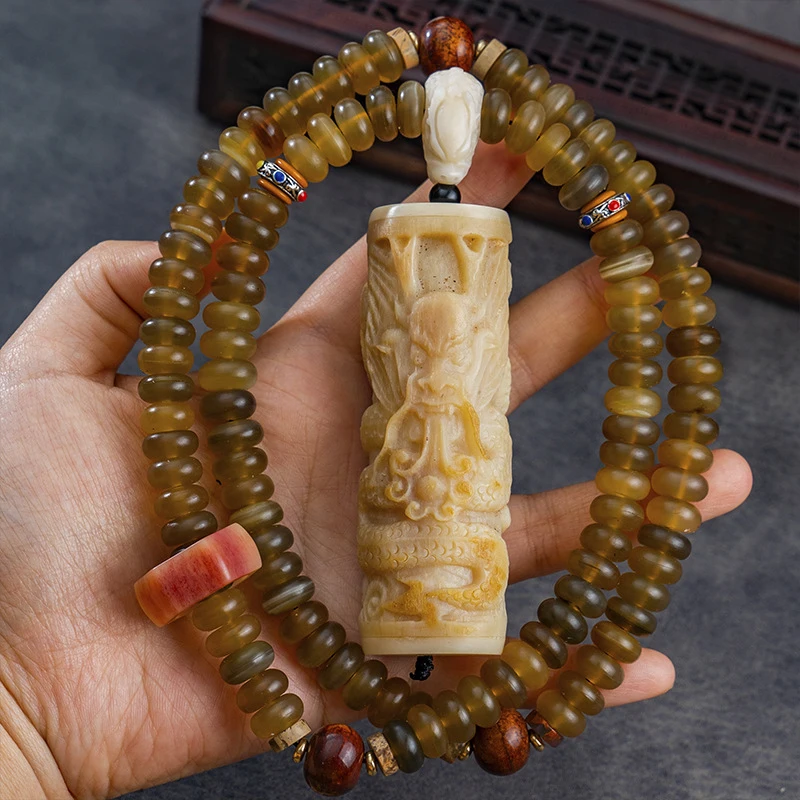 108-piece Panaxia tortoise shell Buddhist beads with bone-carved dragon pillar pendant, semi-glossy hexagonal dragon head three-
108-piece Panaxia tortoise shell Buddhist beads with bone-carved dragon pillar pendant, semi-glossy hexagonal dragon head three-