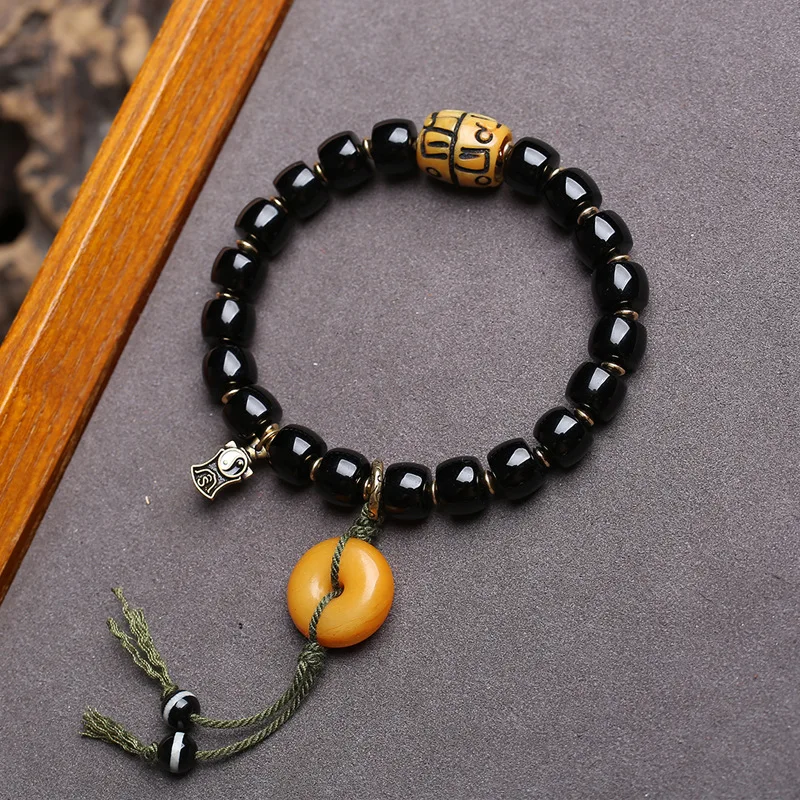 Natural black agate bracelet with barrel beads, reverse-flow bone, peace knot, ivory fruit, peach, monkey head and bodhi seeds
Natural black agate bracelet with barrel beads, reverse-flow bone, peace knot, ivory fruit, peach, monkey head and bodhi seeds
