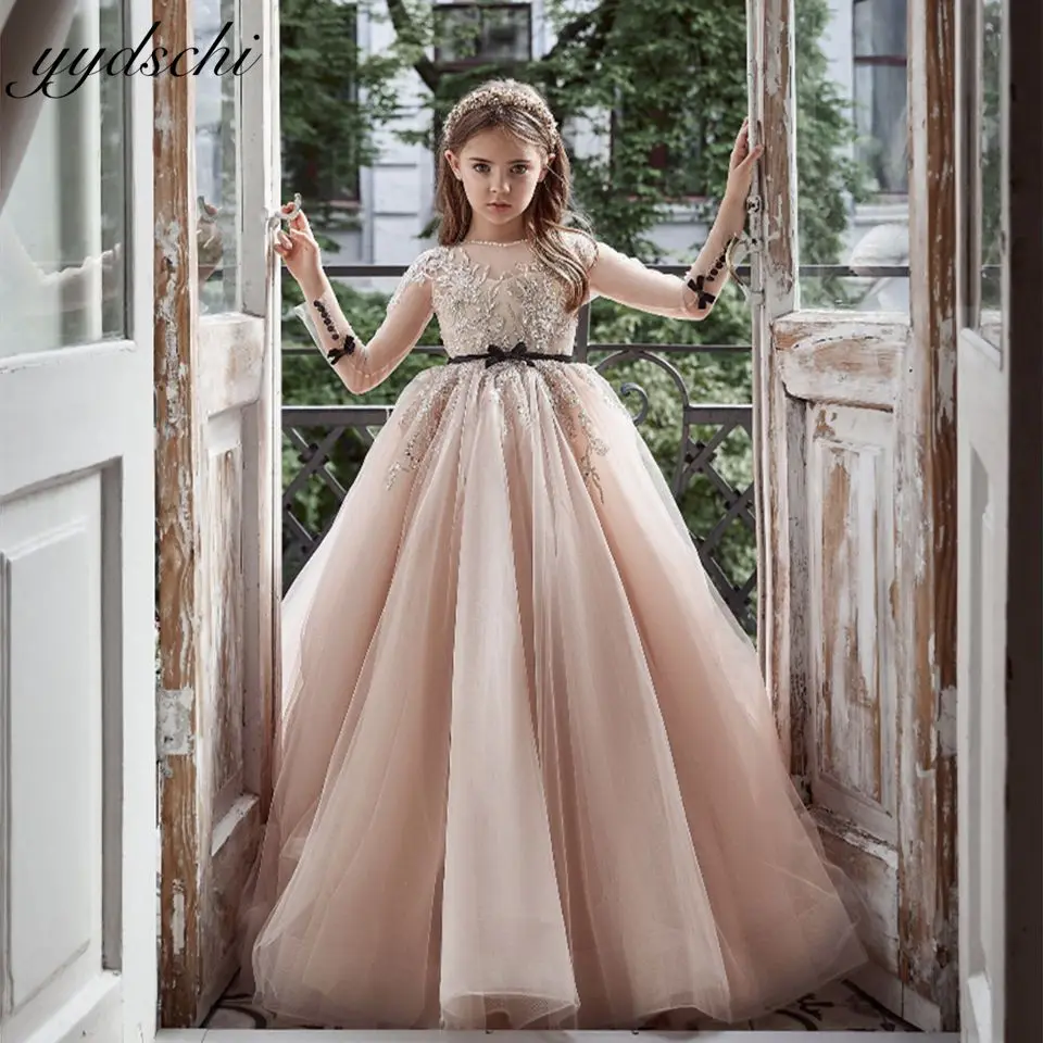 Elegant Nude Color Illusion Long Sleeves Flower Girl Dress 2025 Princess Lace Appliques Sparkle Beaded Kids First Communion Gown
Elegant Nude Color Illusion Long Sleeves Flower Girl Dress 2025 Princess Lace Appliques Sparkle Beaded Kids First Communion Gown