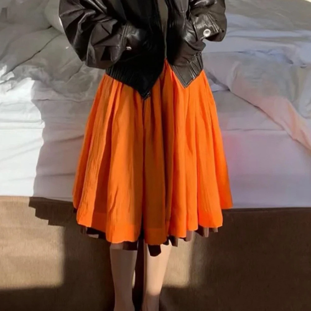 Good-looking orange contrasting splicing pleated skirt women's 2026 new casual temperament fluffy A-shaped skirt
Good-looking orange contrasting splicing pleated skirt women's 2026 new casual temperament fluffy A-shaped skirt