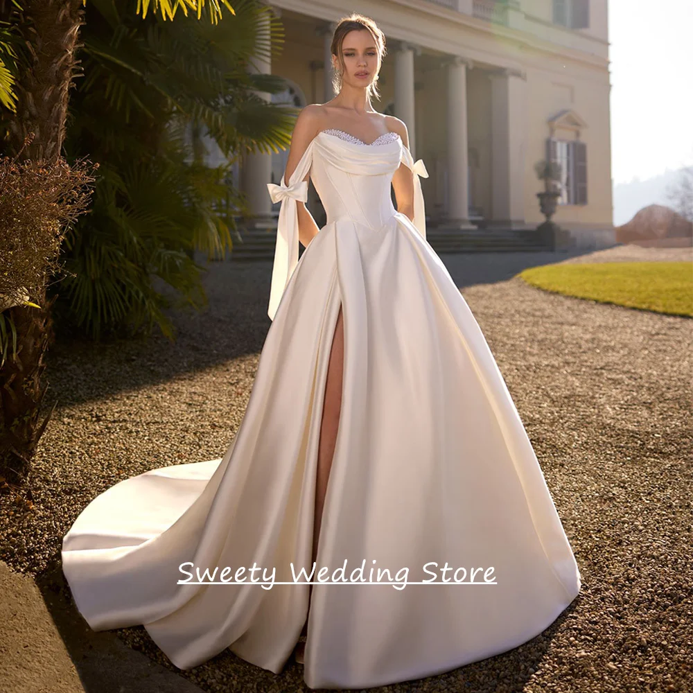 Modern Satin Wedding Gown Customized Off The Shoulder Pearls V Neck Pleat High Split A Line Bridal Dresses Sweep Train
Modern Satin Wedding Gown Customized Off The Shoulder Pearls V Neck Pleat High Split A Line Bridal Dresses Sweep Train