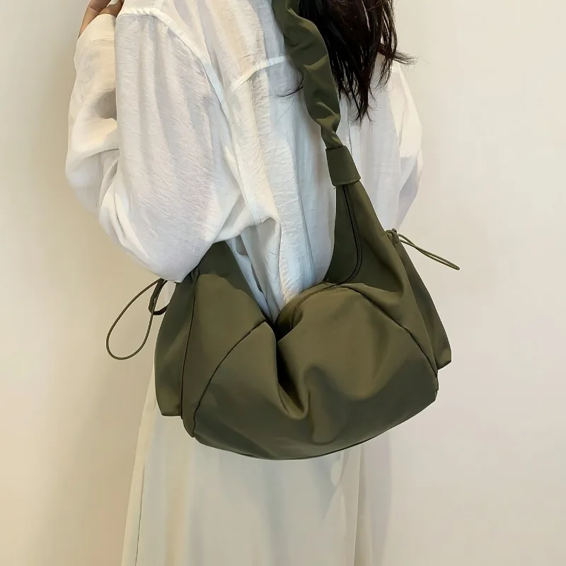 Nylon Multi-Pocket Dumpling Bag for Women, Featuring Wrinkled Design with Drawstring, Perfect for Relaxed Versatile Look
Nylon Multi-Pocket Dumpling Bag for Women, Featuring Wrinkled Design with Drawstring, Perfect for Relaxed Versatile Look