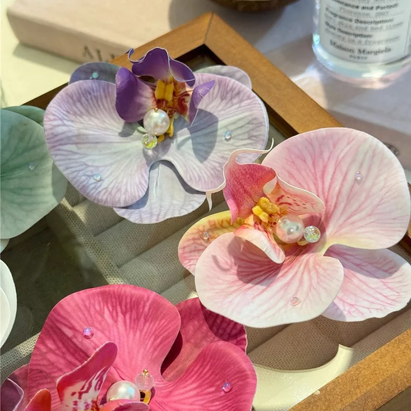 Sweet simulation Phalaenopsis hairpin headgear orchid bangs side clip broken hair forehead clip hair accessories woman
Sweet simulation Phalaenopsis hairpin headgear orchid bangs side clip broken hair forehead clip hair accessories woman