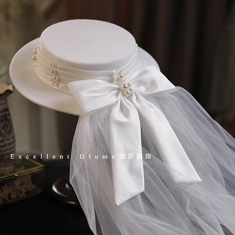 High End Handmade Flat Fedora Cap Bow Mesh Bride White Wedding Hat European Vintage Pearl Rivet Satin Fascinator Mesh Headdress
High End Handmade Flat Fedora Cap Bow Mesh Bride White Wedding Hat European Vintage Pearl Rivet Satin Fascinator Mesh Headdress