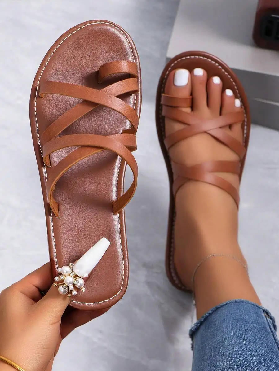 Women’s Brown Flat Slip-On Sandals With Crisscross Straps, Toe Loop, And Decorative Pearl Accent For Summer Casual Beachwear
Women’s Brown Flat Slip-On Sandals With Crisscross Straps, Toe Loop, And Decorative Pearl Accent For Summer Casual Beachwear