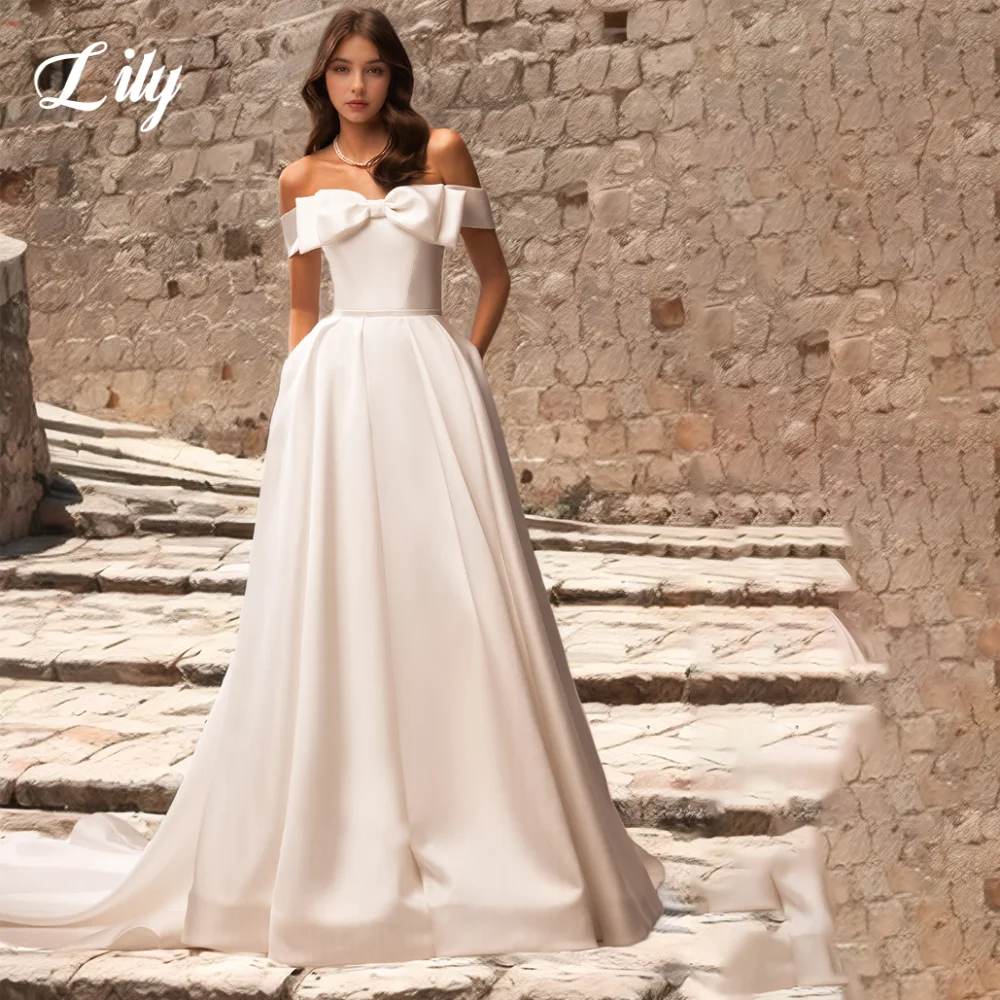 Lily White Elegant Wedding Dress 3D-Bow Off the Shoulder Wedding Gown with Buttons Satin A-Line Trailing Bridal Dress Customized
Lily White Elegant Wedding Dress 3D-Bow Off the Shoulder Wedding Gown with Buttons Satin A-Line Trailing Bridal Dress Customized