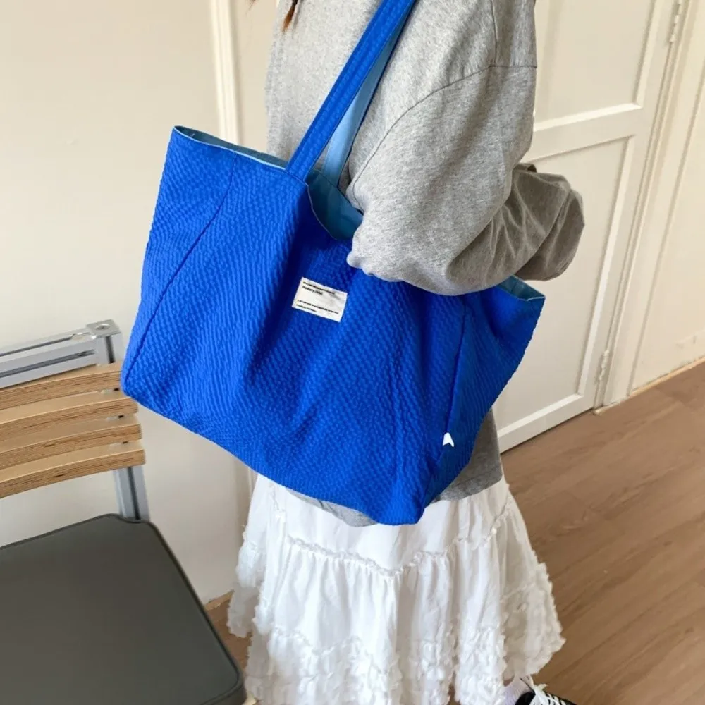 Однотонная двусторонняя сумка-тоут, универсальная вместительная холщовая сумка через плечо с вышивкой букв, повседневная женская сумка
Однотонная двусторонняя сумка-тоут, универсальная вместительная холщовая сумка через плечо с вышивкой букв, повседневная женская сумка