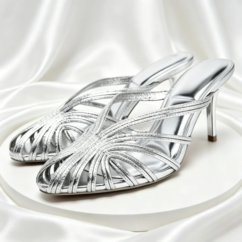 Luxury Designer Silver Mules Slippers Women 2026 Summer Narrow Band Peep Toe Thin High Heels Sexy Hollow Out Slides Sandals
Luxury Designer Silver Mules Slippers Women 2026 Summer Narrow Band Peep Toe Thin High Heels Sexy Hollow Out Slides Sandals