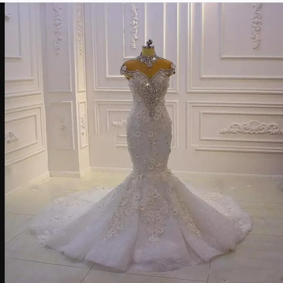 Customized Luxury Crystals Beads High Neck Bridal Dresses Robes De Mariée Real Photo 3 D Floral Mermaid Wedding Gowns
Customized Luxury Crystals Beads High Neck Bridal Dresses Robes De Mariée Real Photo 3 D Floral Mermaid Wedding Gowns